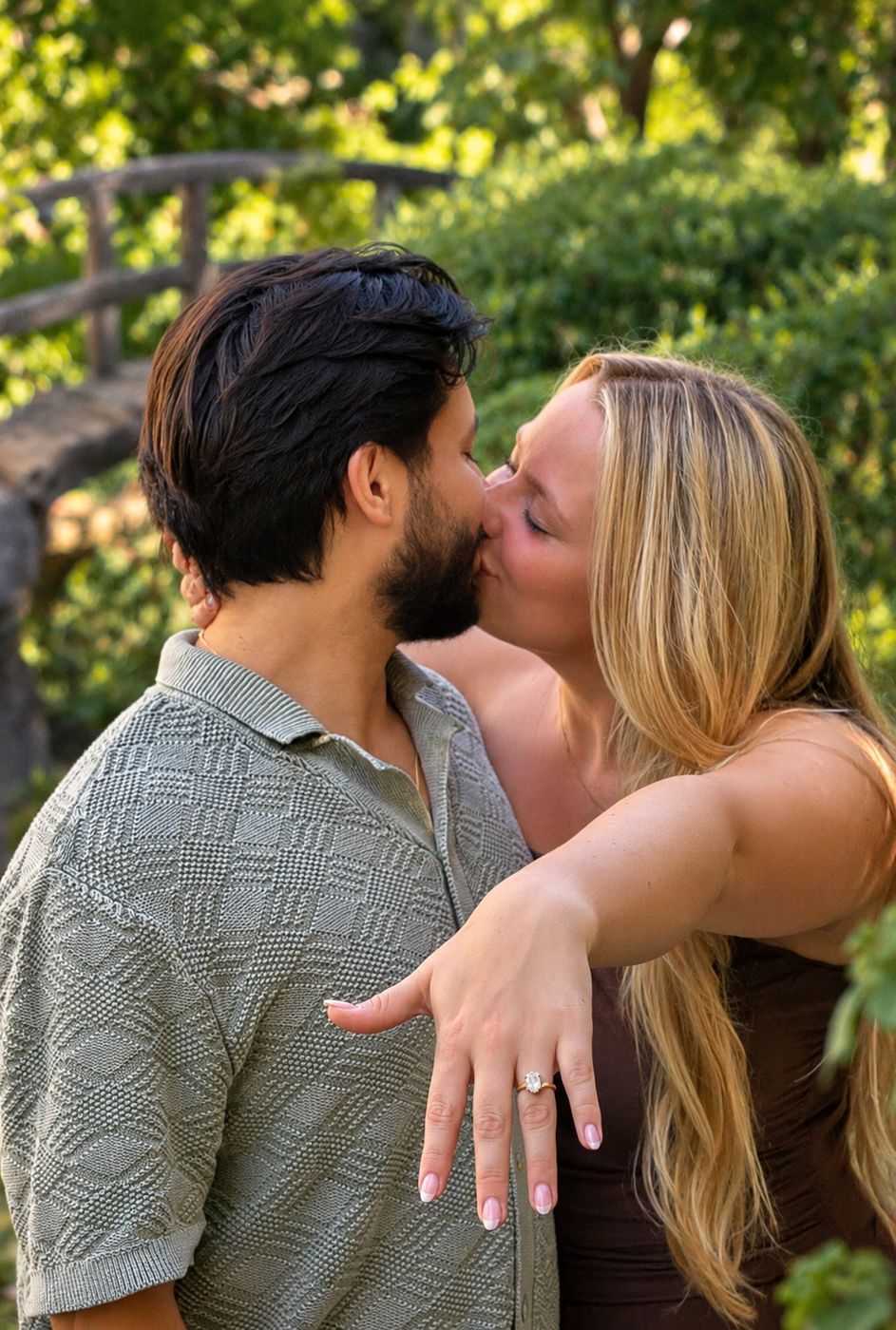 Hailey and Alan kissing as Hailey shows her engagement ring