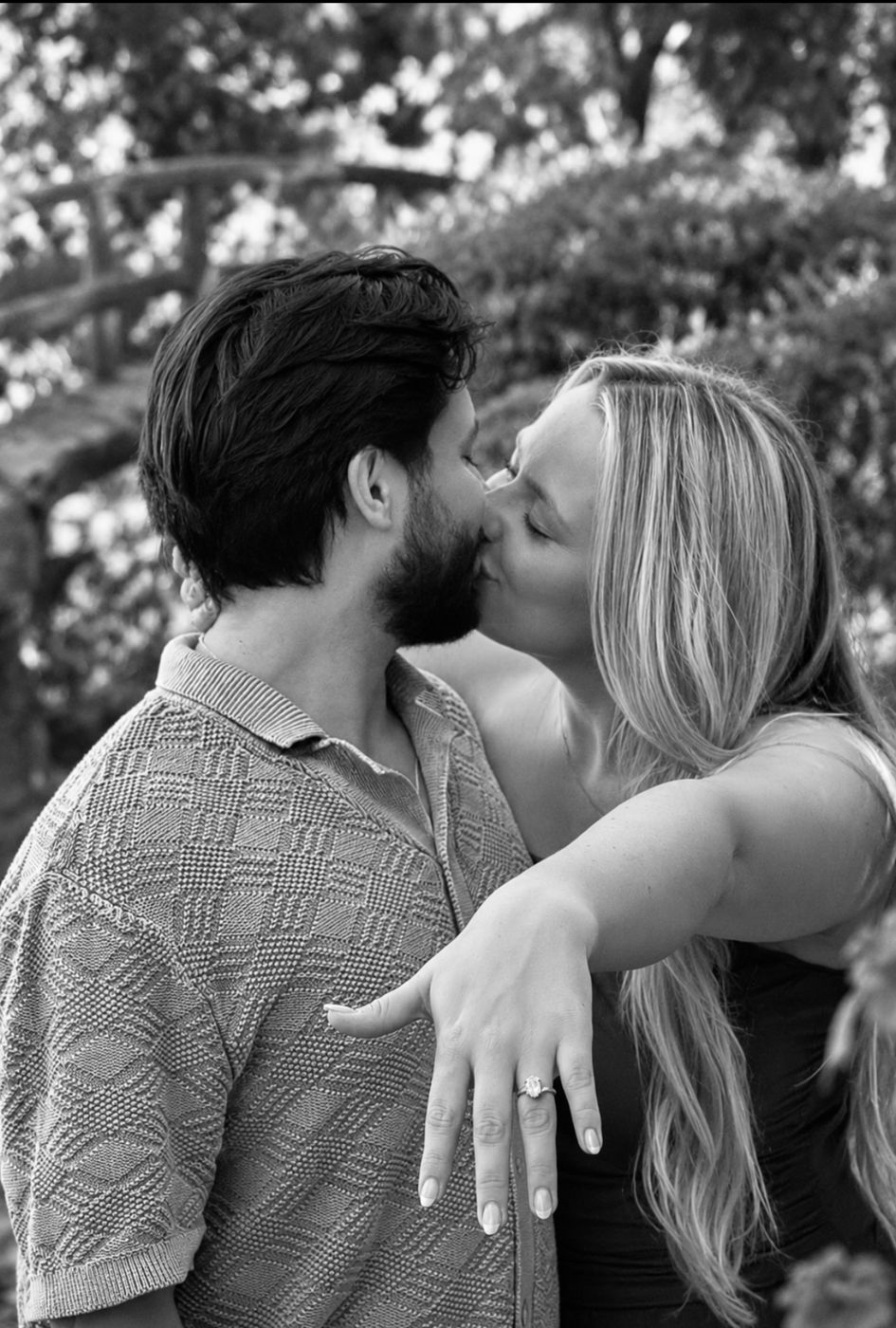 Black and white photo of Hailey and Alan kissing